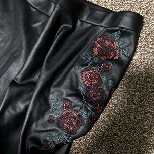 faux leather pants with rose details